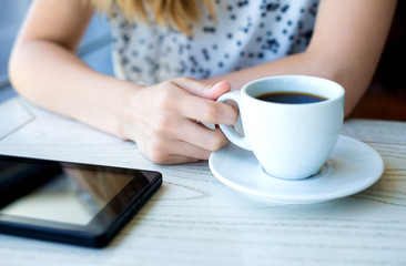 businesswoman  in a cafe drinking coffee