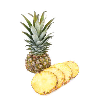 Pineapple with slices on a white background.