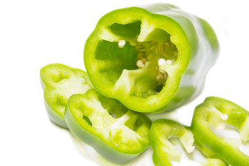 chopped green pepper, white background