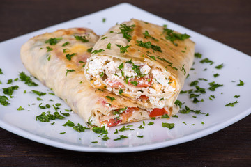 Pita bread wrapped with cottage cheese and vegetables