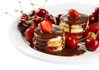 Tasty biscuit cakes with chocolate and berries