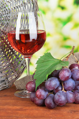 Ripe delicious grapes with glass of wine