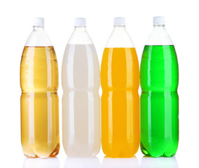 Assortment of bottles with tasty drinks, isolated on white