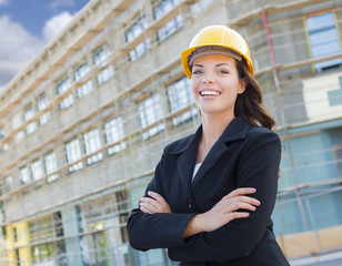 Portrait of Female Contractor Wearing Hard Hat at Construction S