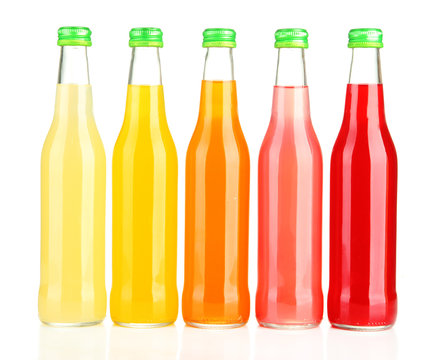 Bottles with tasty drink, isolated on white