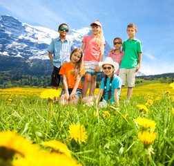 Kids in the mountains flower field