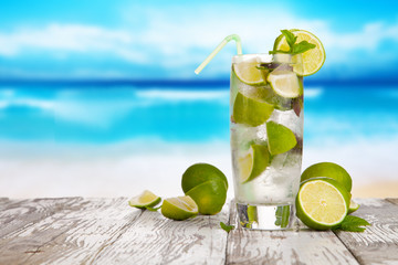 Summer drink with blur beach on background 