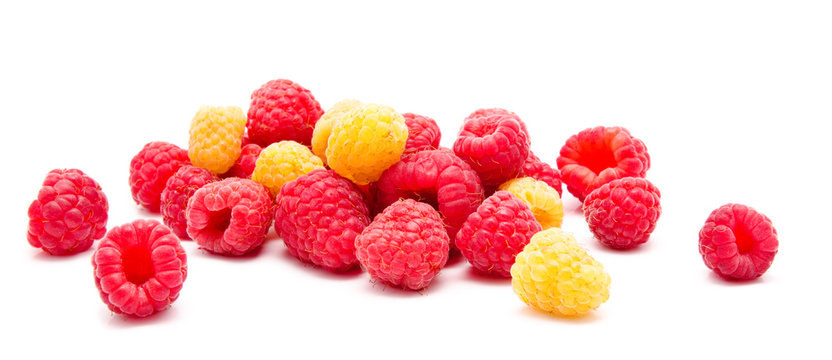 Heap of red and yellow raspberry isolated