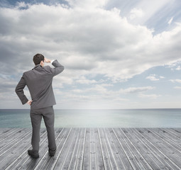 Well dressed businessman standing on wooden boards