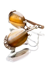 Obraz na płótnie Canvas Earrings with a dark amber