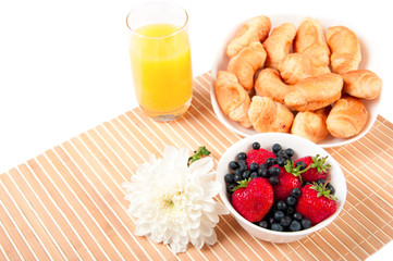 Breakfast with berries,orange juice and croissant