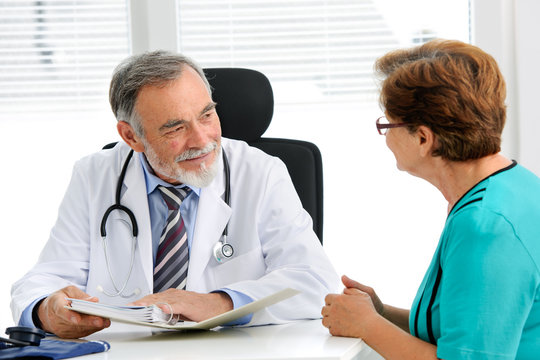Doctor talking to his female patient