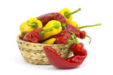 red and yellow peppers in a basket