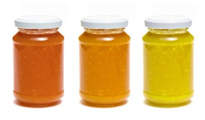 Three bottle of jam on white background