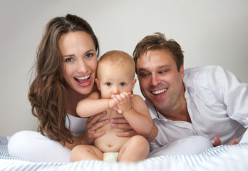 Happy young family with baby
