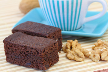 Chocolate brownie with cup of coffee