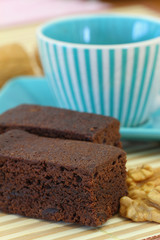 Chocolate brownie with cup of coffee