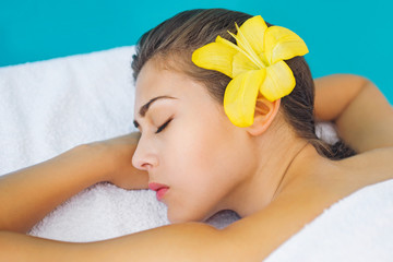 Obraz na płótnie Canvas Beautiful brunette relaxing at spa treatment