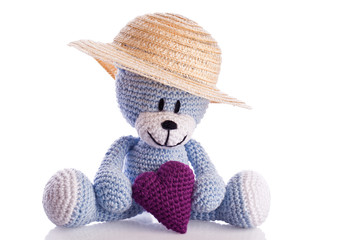 blue knitted teddy bear with hat and heart