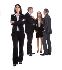 Businesswoman Standing In Front Of Her Colleagues