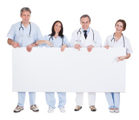 Group Of Doctor Holding Placard