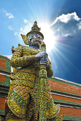 Fototapeta premium Ancient giant sculpture of The Emerald Buddha temple in Bangkok,