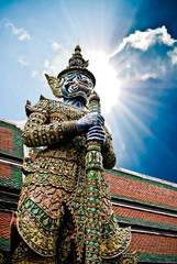 Fototapeta premium Ancient giant sculpture of The Emerald Buddha temple in Bangkok,