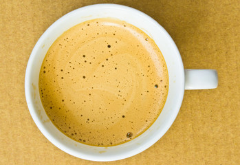 close up of coffee cup on white background