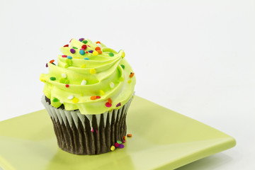 Festive chocolate cupcake with green frosting