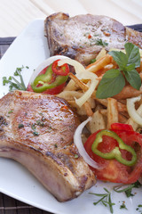 Fried pork chops and vegetables