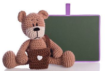 teddy bear with scool bag and blackboard