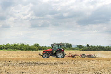 Fototapeta na wymiar Tractor preparation the field
