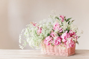 pink peony in basket