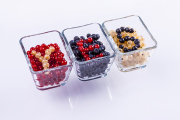 Blue berry, red and white currant - white background.