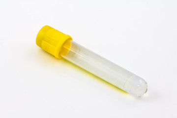 test tube with yellow plug  isolated on white background
