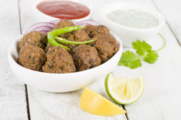 Kofta - South Asian meatballs with chili sauce and mint raita