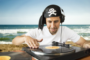 DJ mixing  pirate on the beach