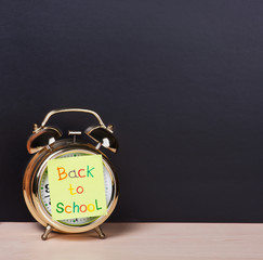 alarm clock and sticker with text back to school