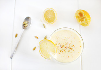 Milkshake with banana and mango, lemons, cardamom smoothie