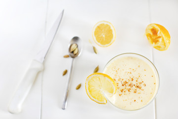 Mango and banana yoghurt smoothie lassi with lemons and cardamom