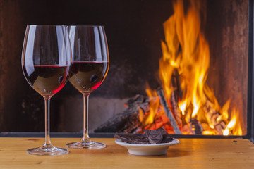 delicious wine, drinks and snacks at fireplace