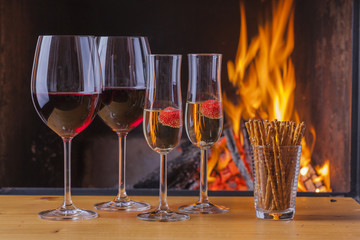 delicious wine, drinks and snacks at fireplace