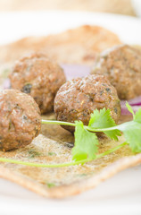 Kati Roll - Kofta and red onion in a paratha fried with eggs