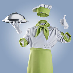 invisible chef with restaurant cloche or tray on a blue backgrou