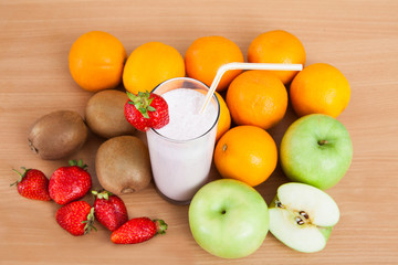 Close-up Of Strawberry Milkshake And Fruits