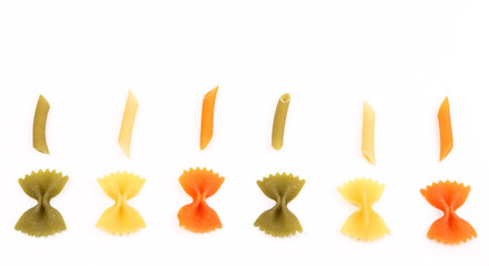Fototapeta premium Composition of different pasta in three colors.
