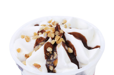 Ice cream with chocolate topic and nuts.
