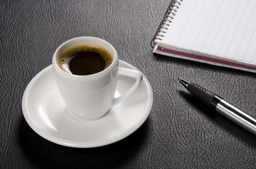Fototapeta na wymiar Coffee, pen and pad