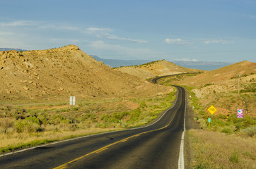 Winding Road in a Desert Landscape at Sunset