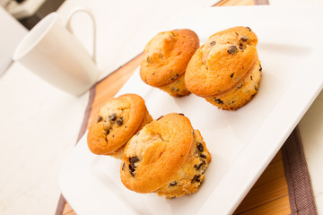 Vanilla with chocolate chips Muffins with a cup of coffee